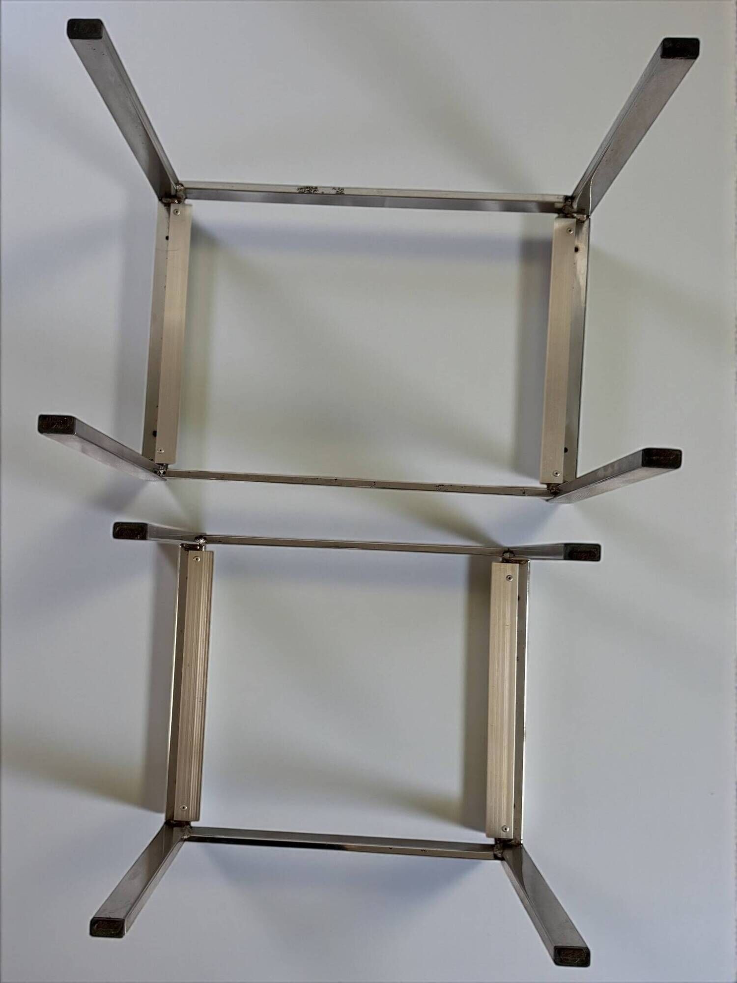 Vintage 1970s nesting tables in chrome and smoked glass, mid-century modernist style