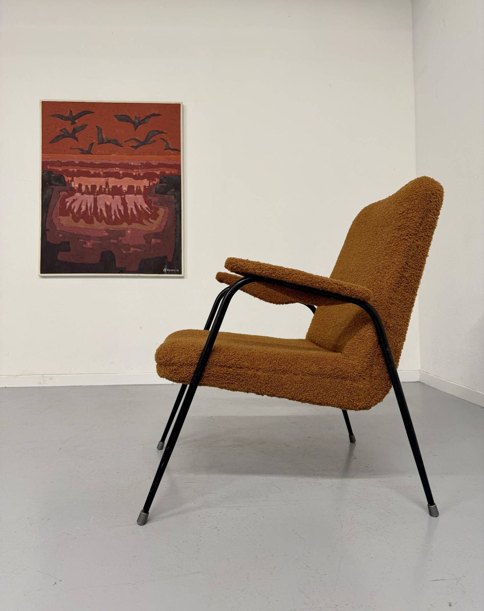 Vintage metal armchair with orange boucle fabric, French design from the 1950s.