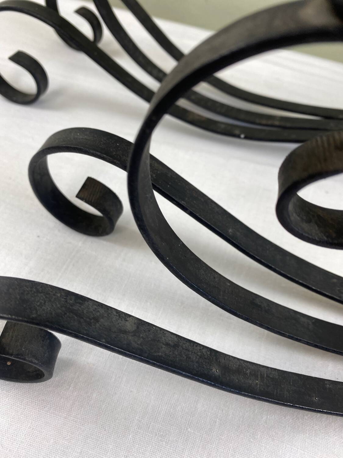 Pair of wrought iron candlesticks