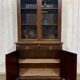 English walnut two-body library from the early 20th century.
