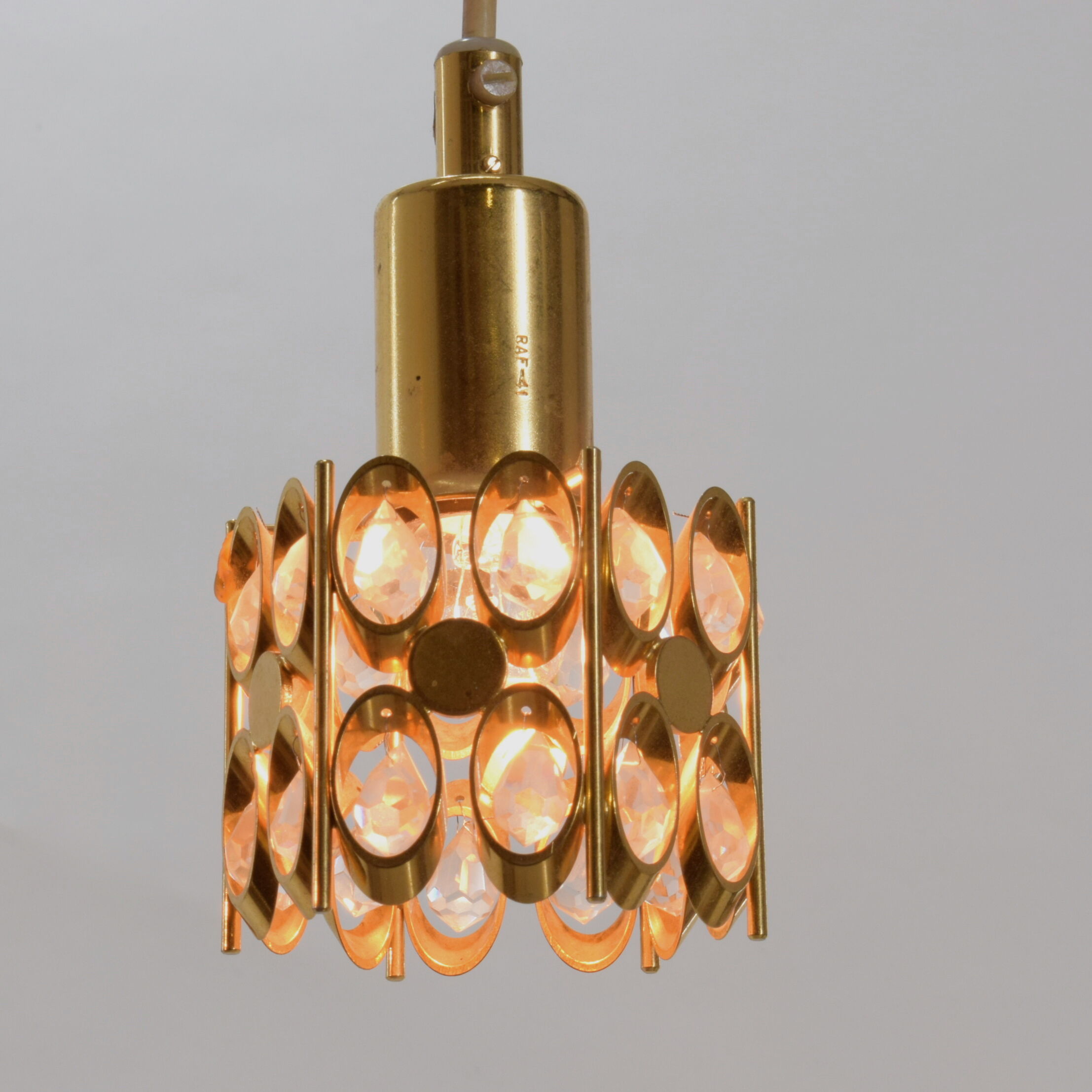 Two pendant lights in gilded brass and crystal, by Palwa, design 1960