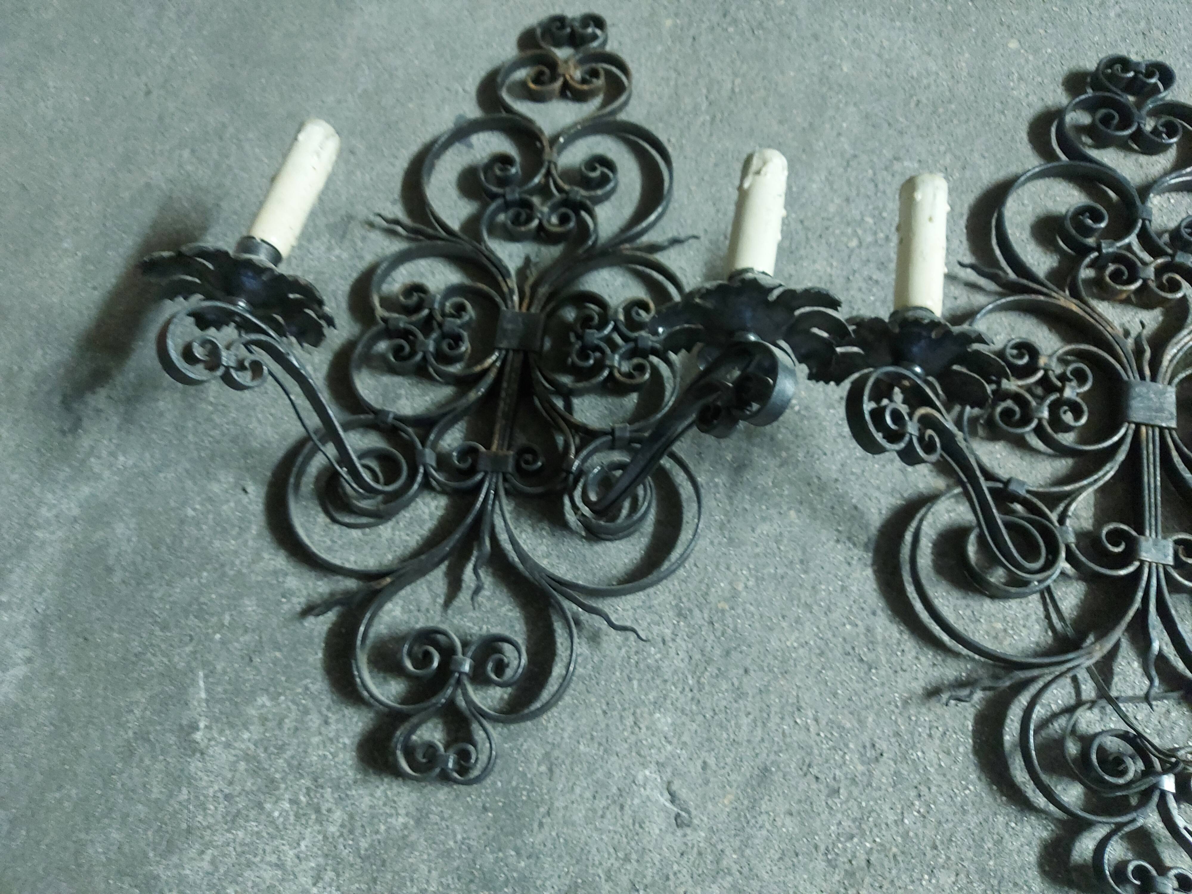Two large wrought iron wall lights