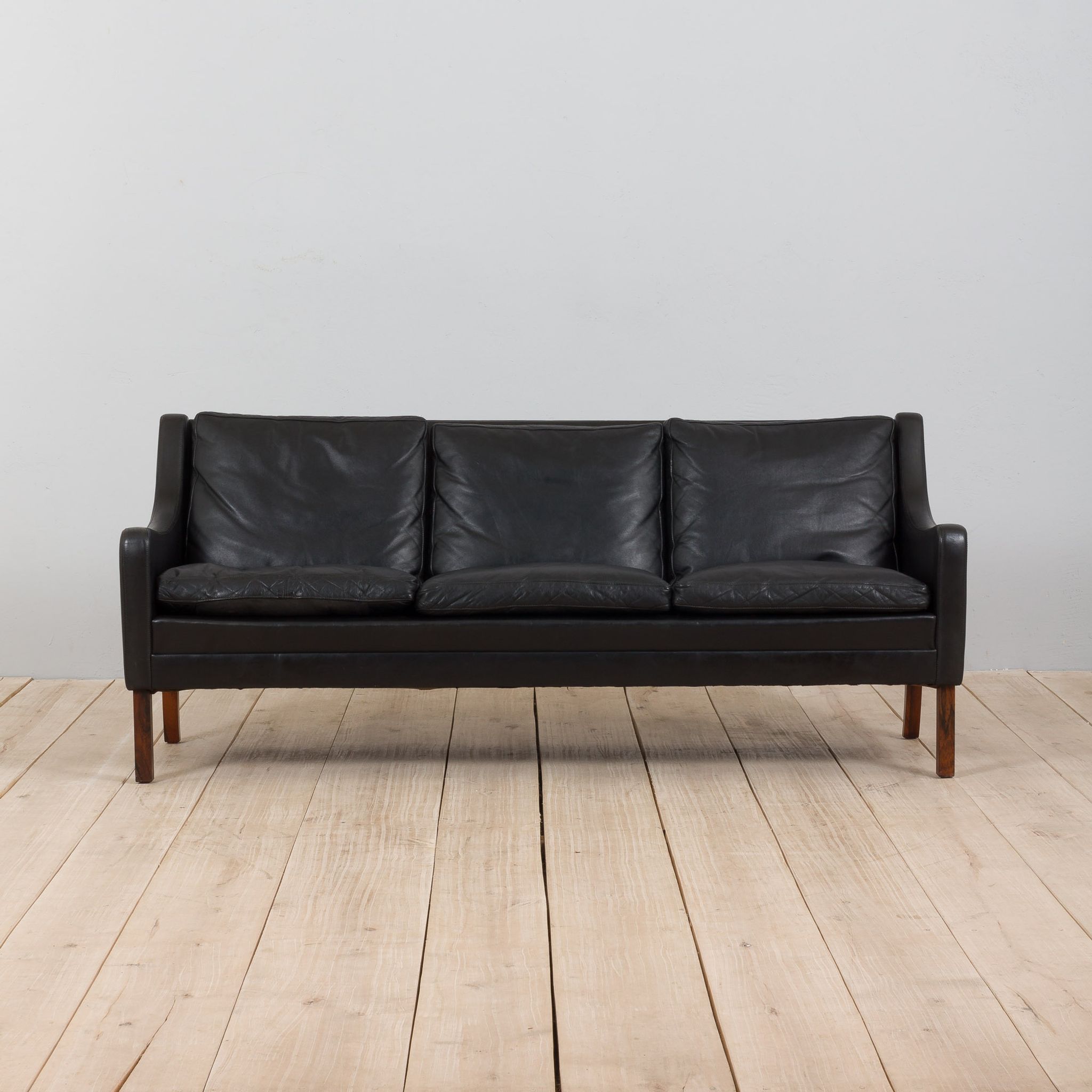 Danish black leather and rosewood sofa