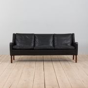 Danish black leather and rosewood sofa