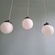 Art Deco trio of suspensions in white opaline, 1930s