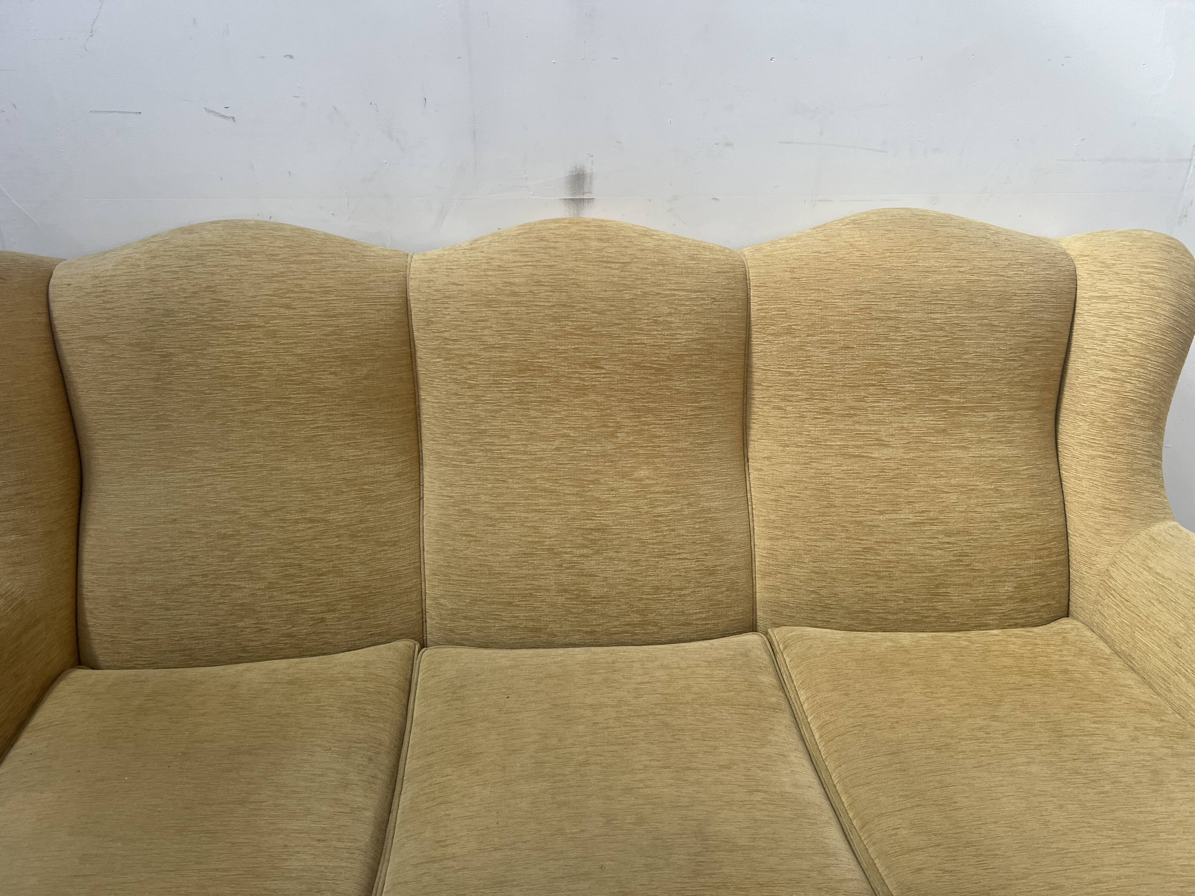 Louis XV style three-seater wingback sofa in patinated beech, 20th century