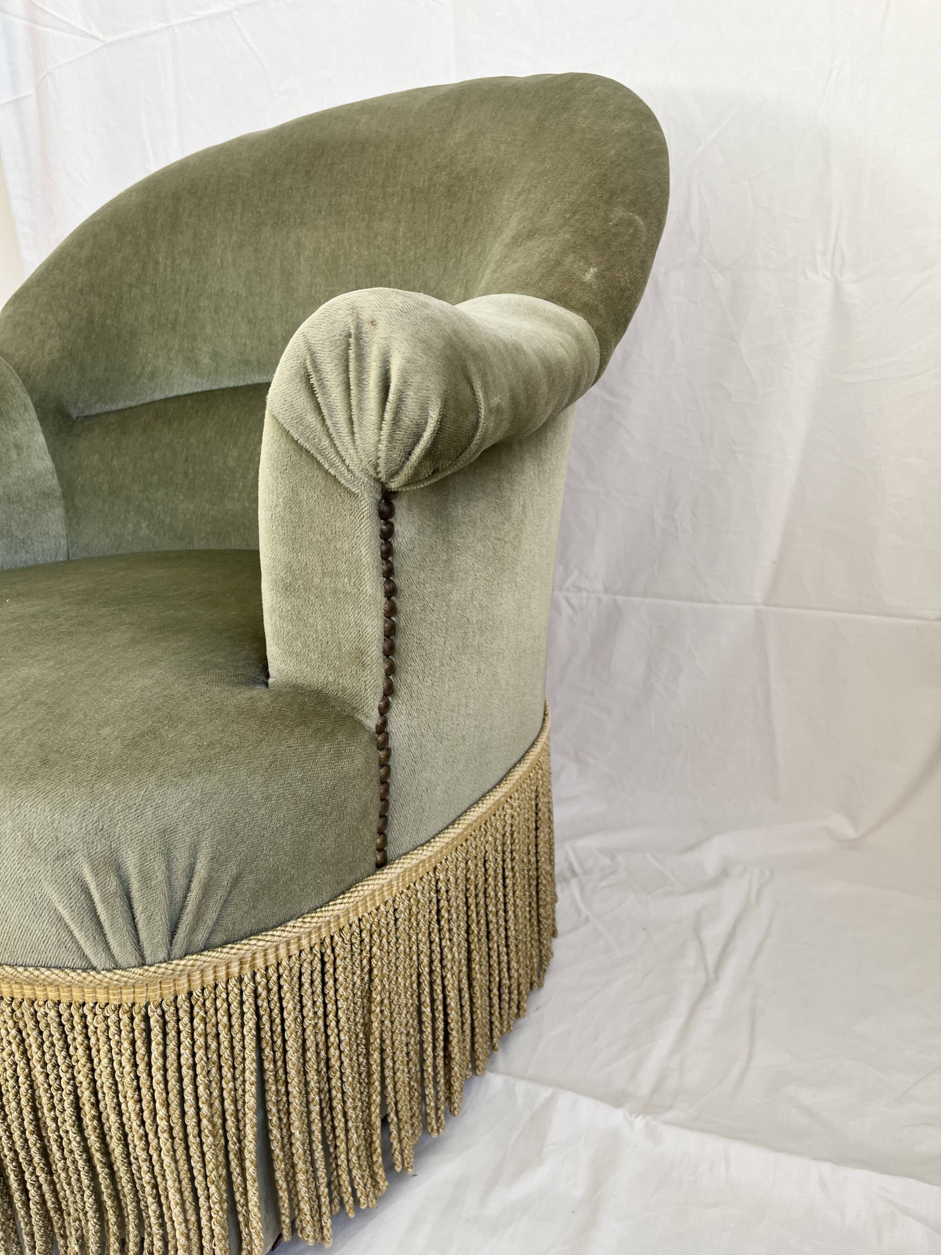 sage green toad armchairs with gold fringe