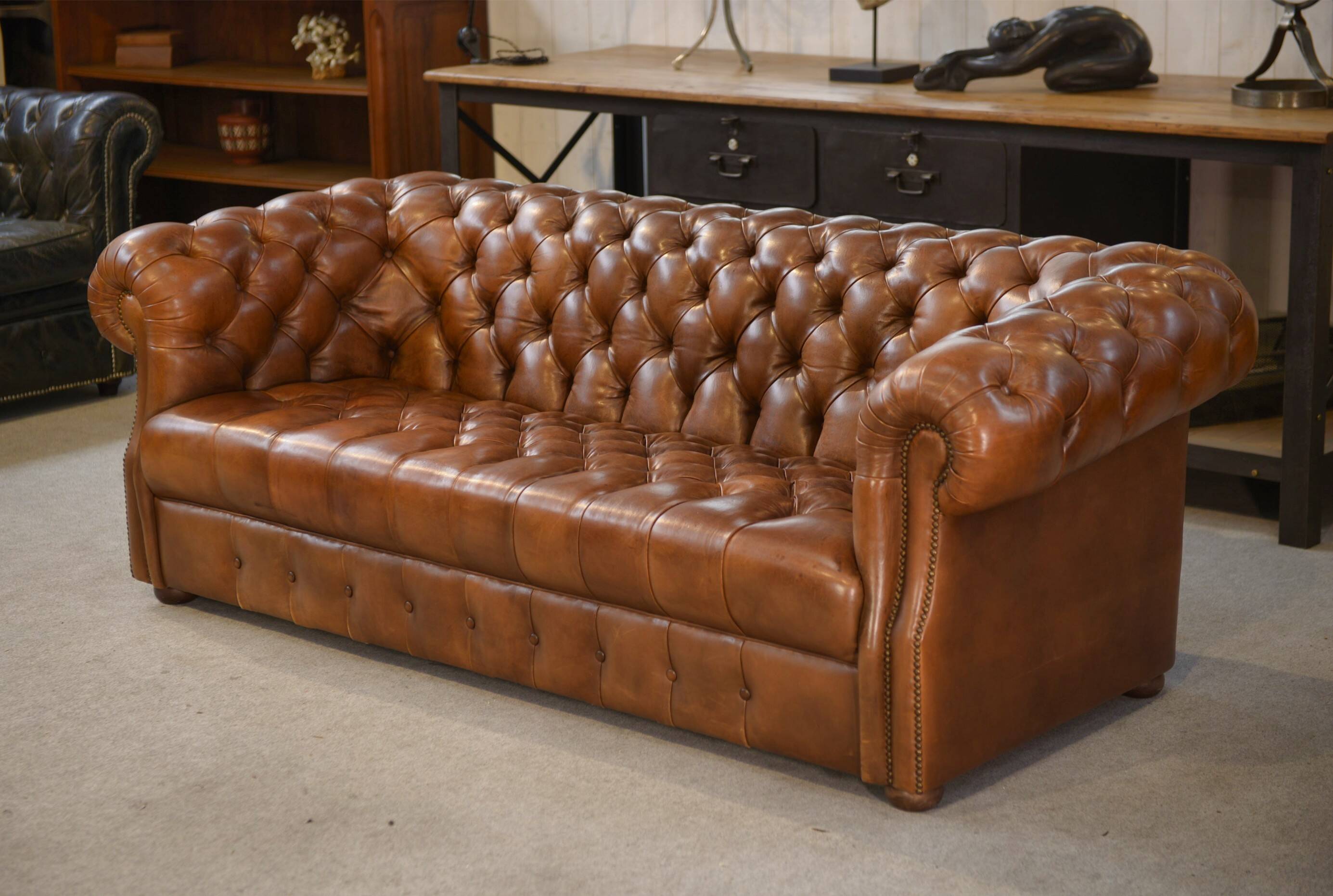 Tan leather tufted Chesterfield sofa