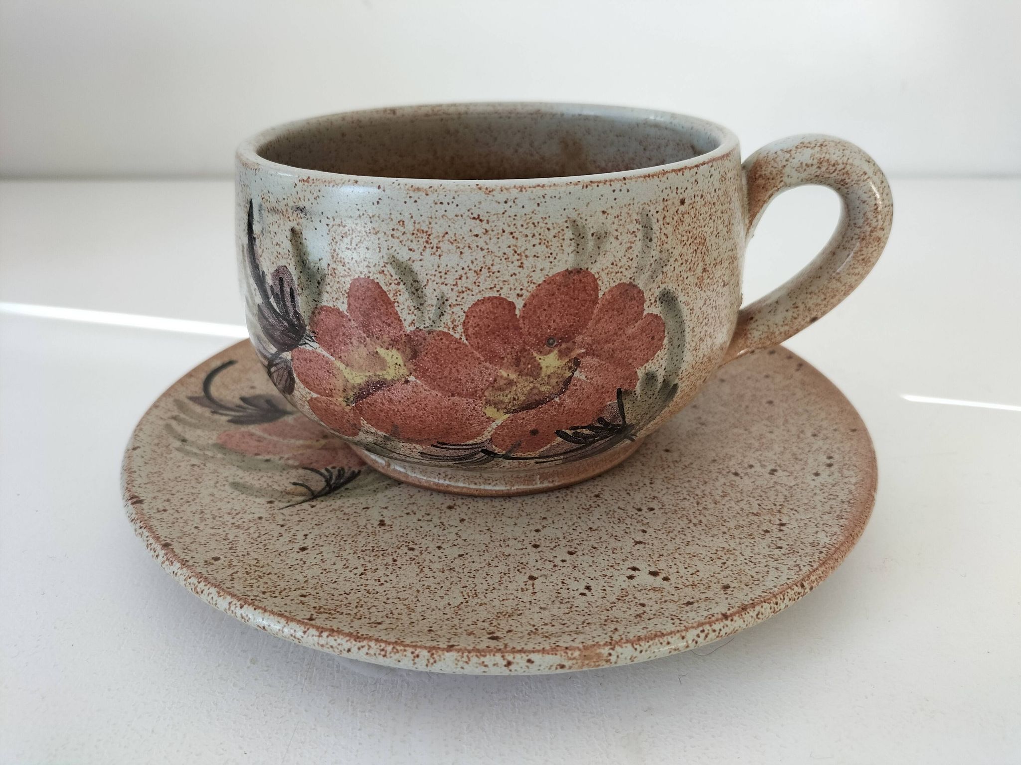Large stoneware cup and saucer with floral decoration – 1970s