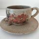 Large stoneware cup and saucer with floral decoration – 1970s