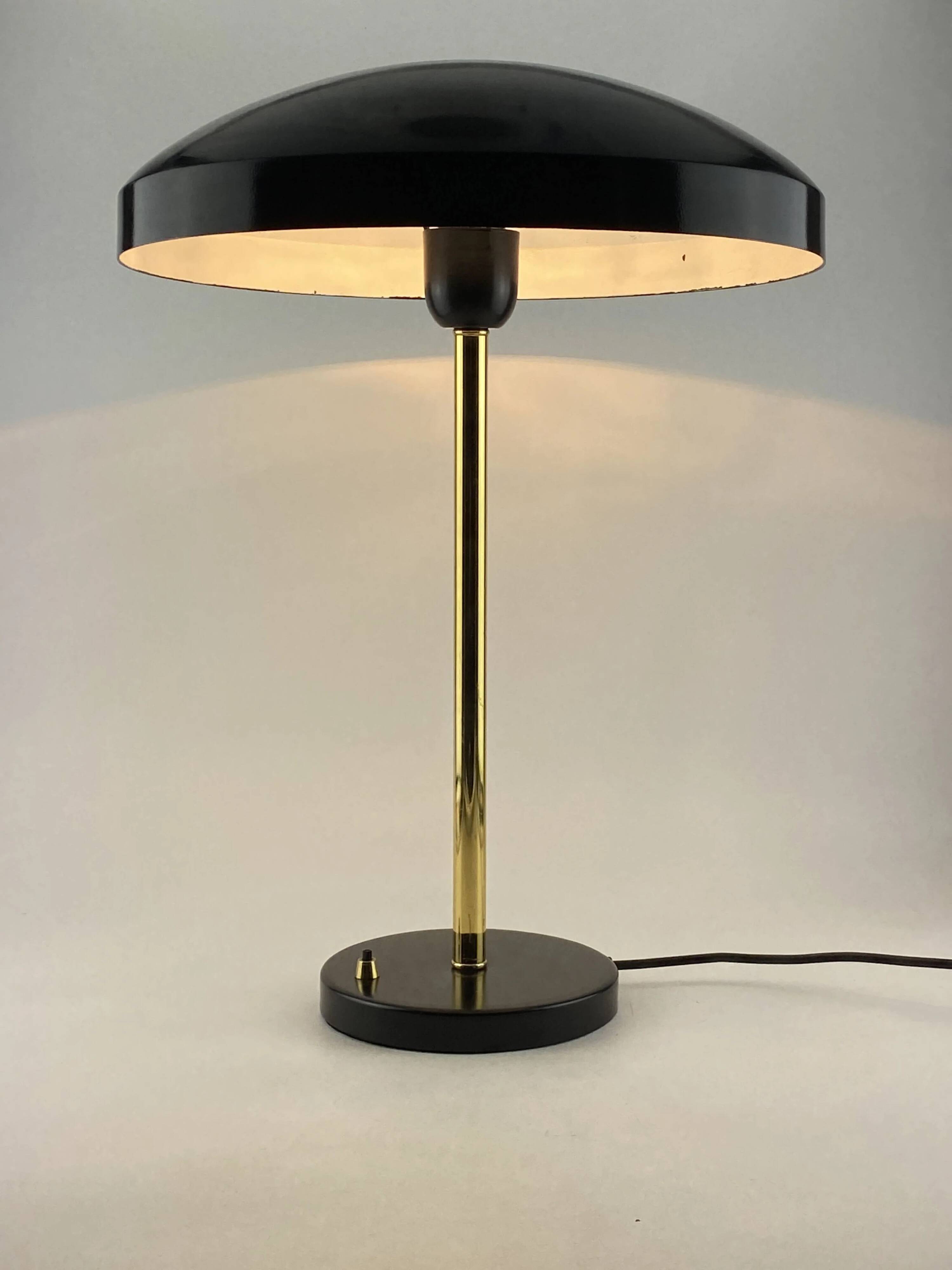 Rare black and gold UFO table lamp by Louis Kalff for Philips.
