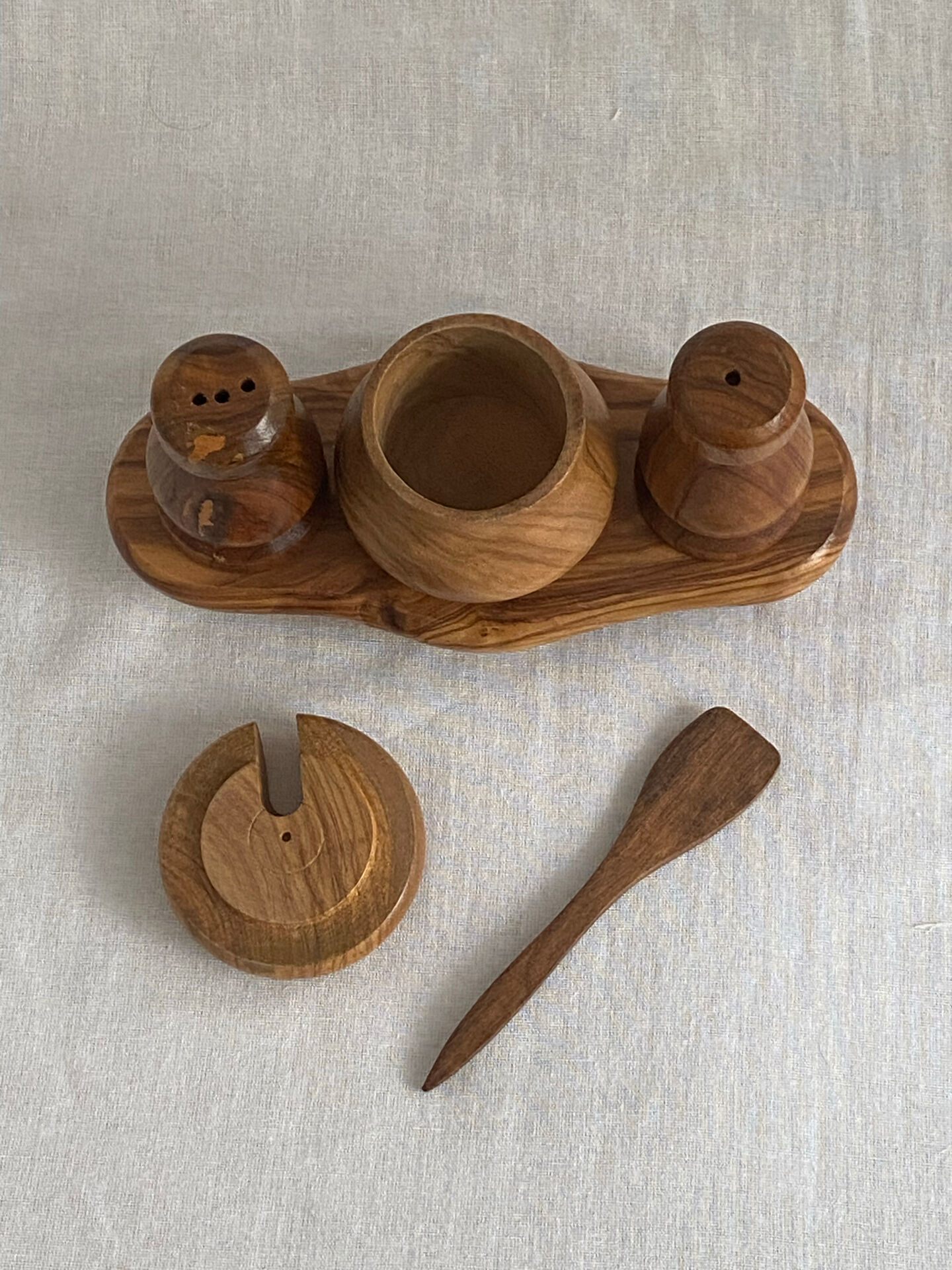 Condiment service (salt, pepper, and mustard) in olive wood