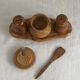 Condiment service (salt, pepper, and mustard) in olive wood