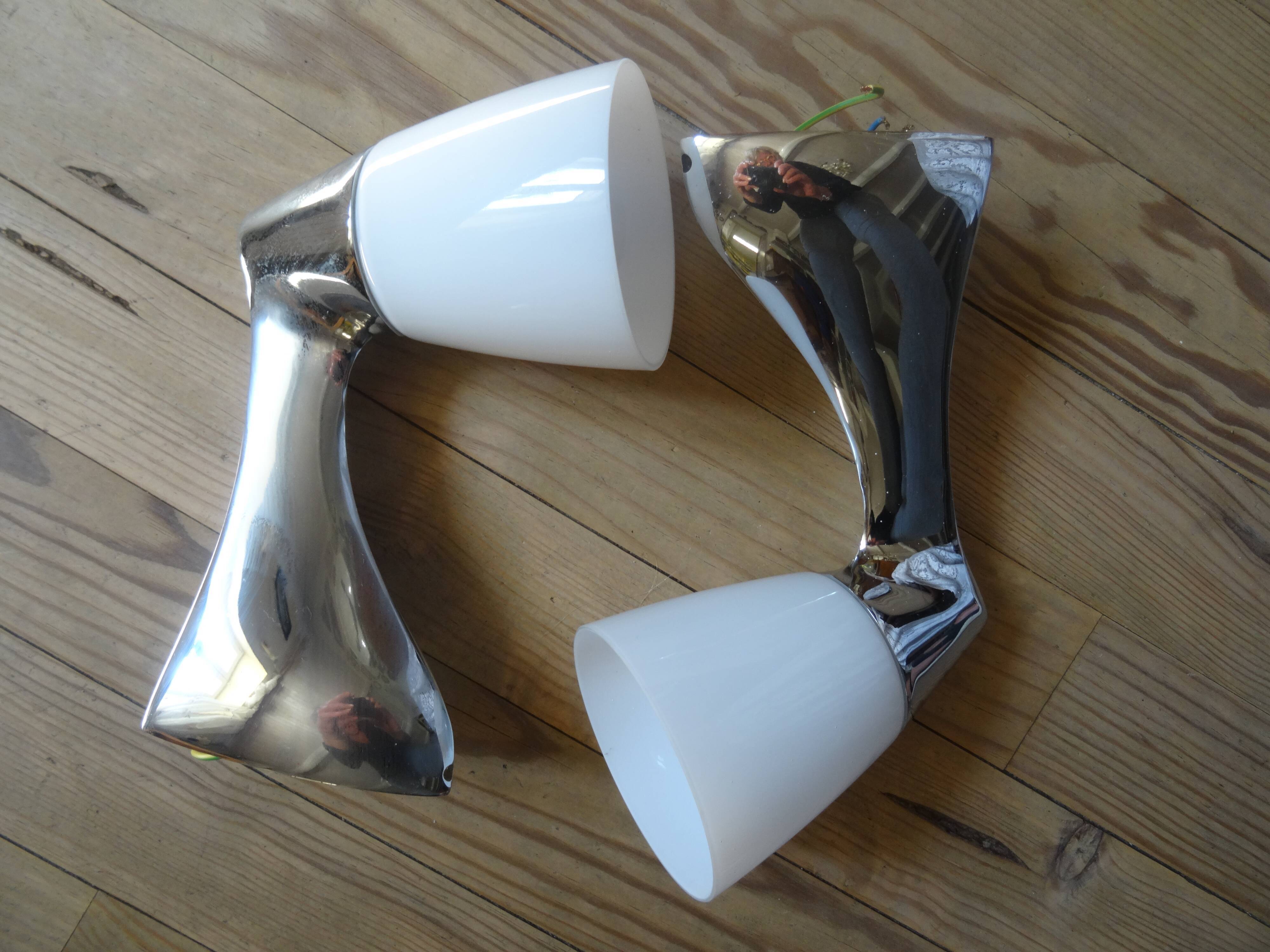 Pair of stainless steel and opaline wall lamps