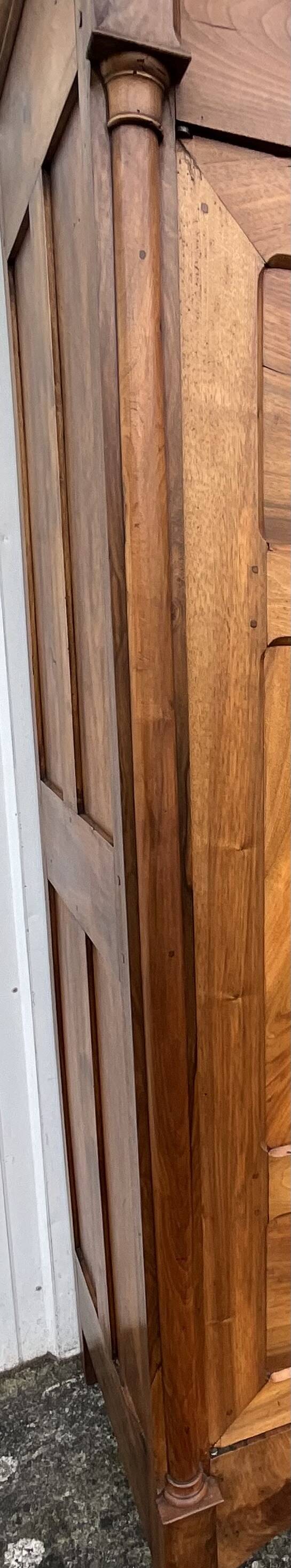 Empire wardrobe in solid walnut, France, mid-19th century.