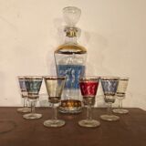 Liquor carafe and 6 assorted glasses