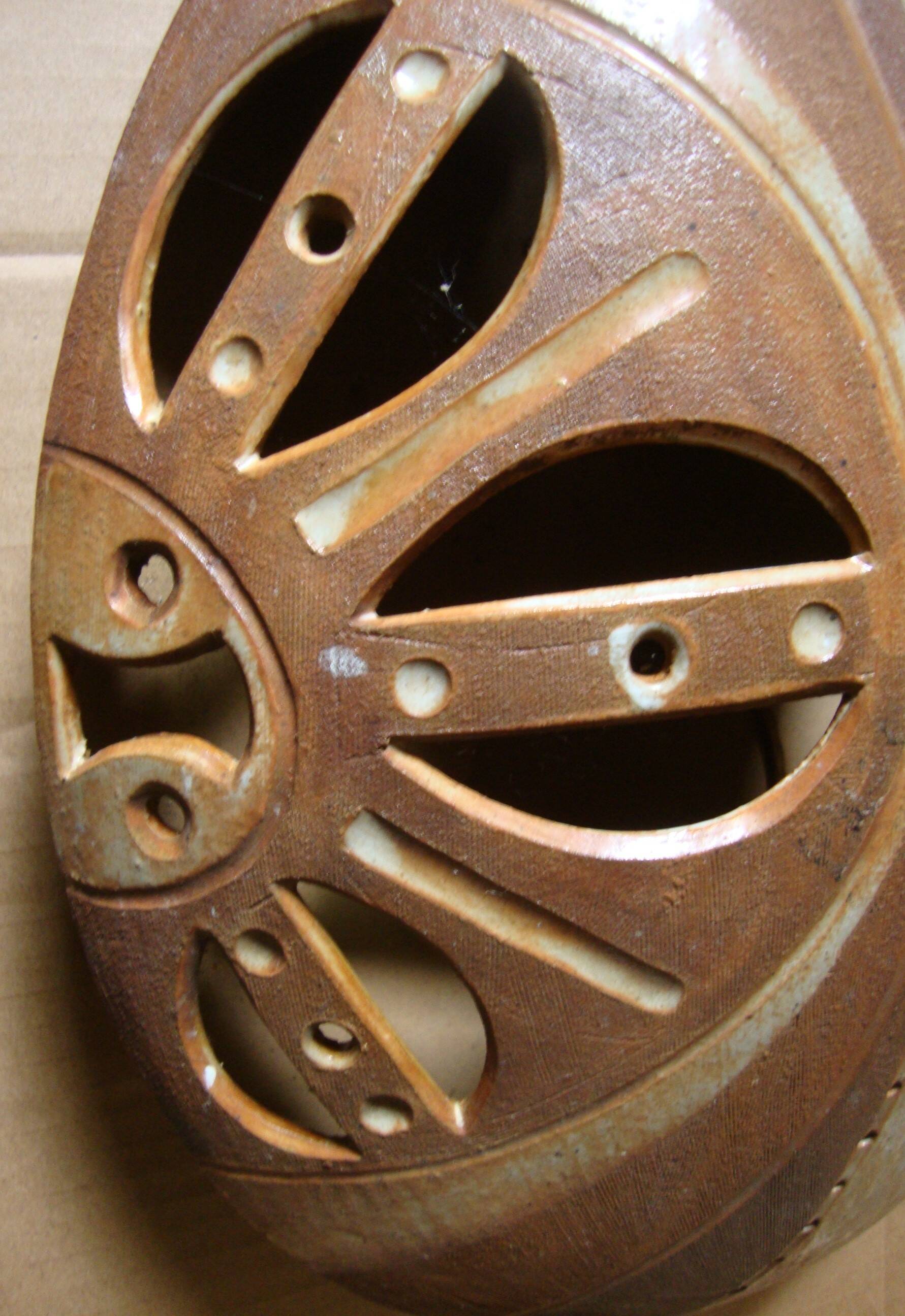 Ethnic ceramic wall lamp signed.