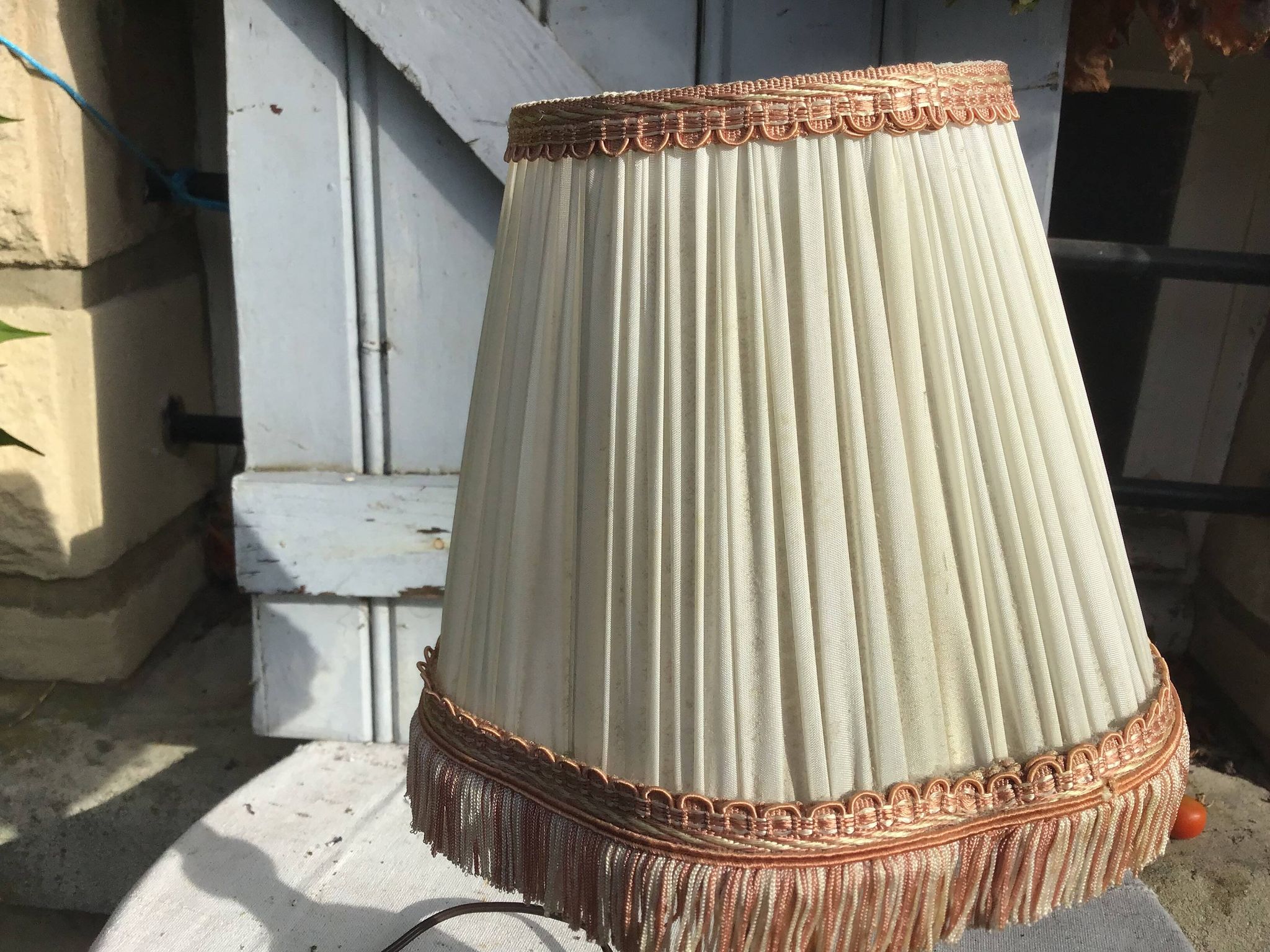 Turned wooden foot lamp with pleated lampshade