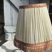 Turned wooden foot lamp with pleated lampshade