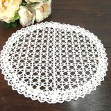 Handmade oval placemat in crocheted cotton lace