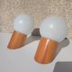Pair of vintage wall lights in varnished pine and opal glass, 1970s-80s.