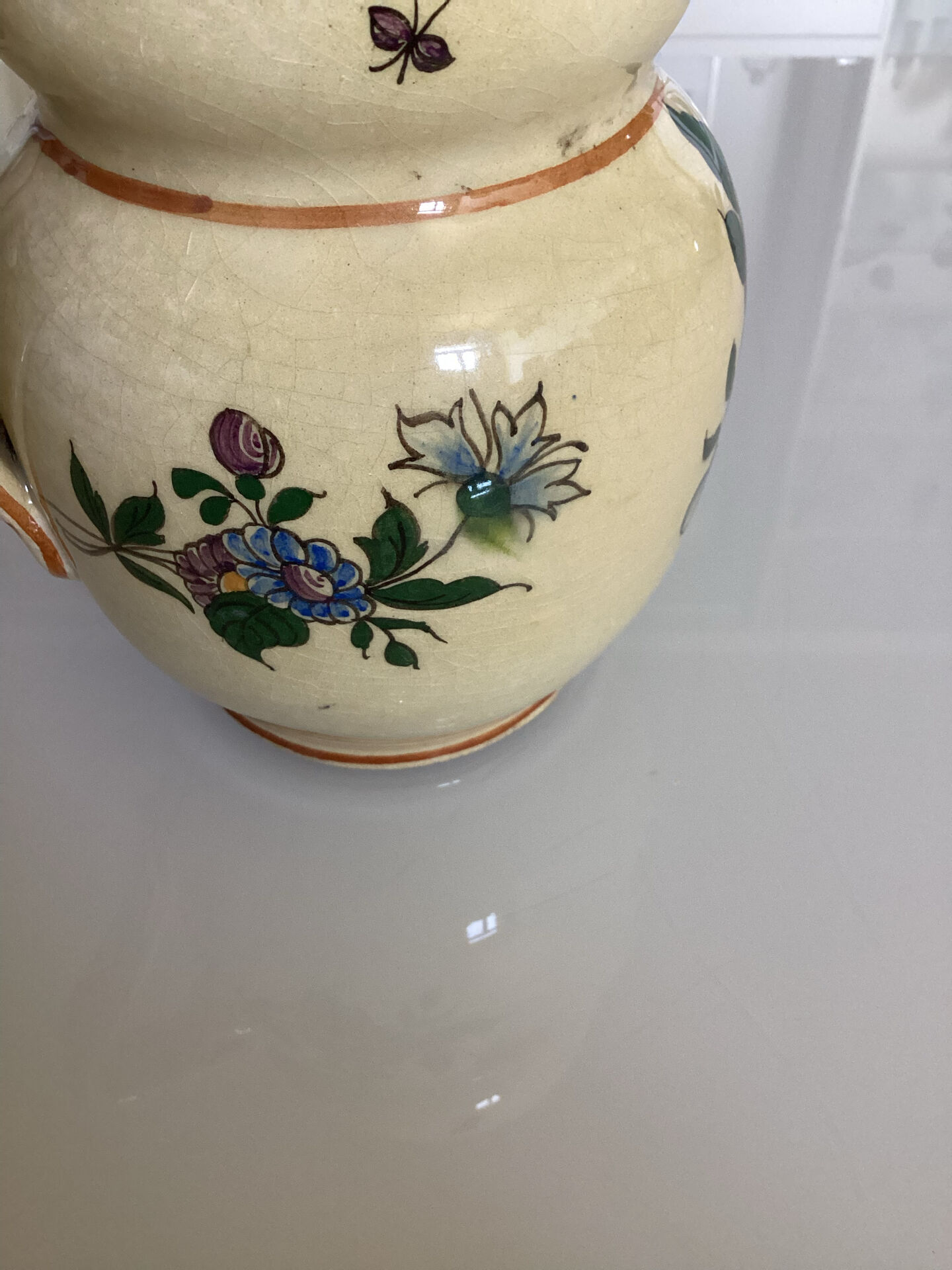 Old ceramic jug with floral decoration