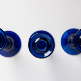 Three cobalt blue candlesticks