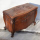 Old chest, carved wooden chest, curved chest on wheels, interior decoration