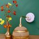 Applique coudée globe vintage en verre granité jaune et or