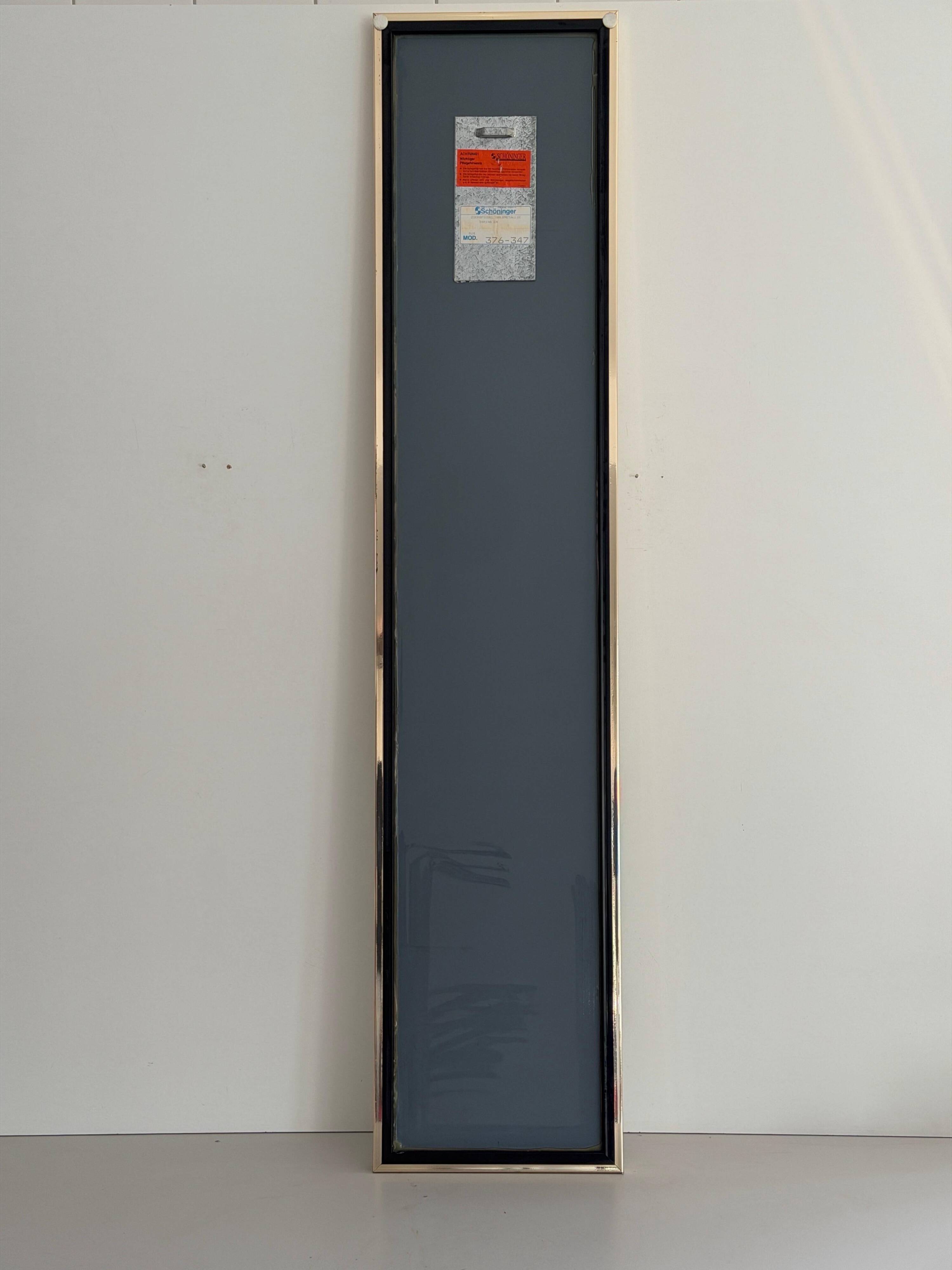 Rectangular wall mirror with a gold metal frame by Schöninger, 1970s, Germany.