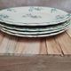 Set of 4 antique dessert plates in ironstone, with blue and green floral decoration.