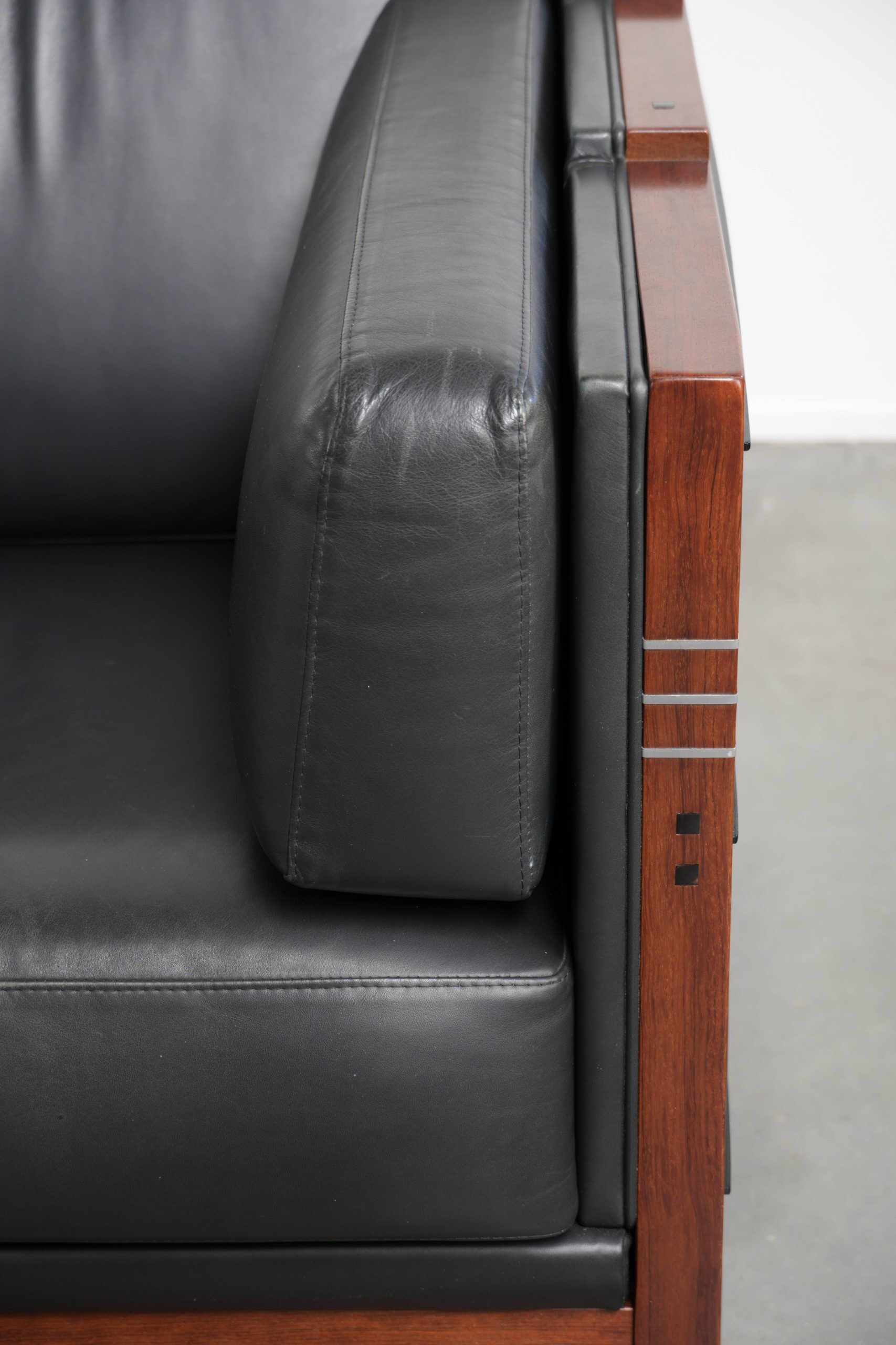 3-seater black cow leather sofa in timeless Art Deco design