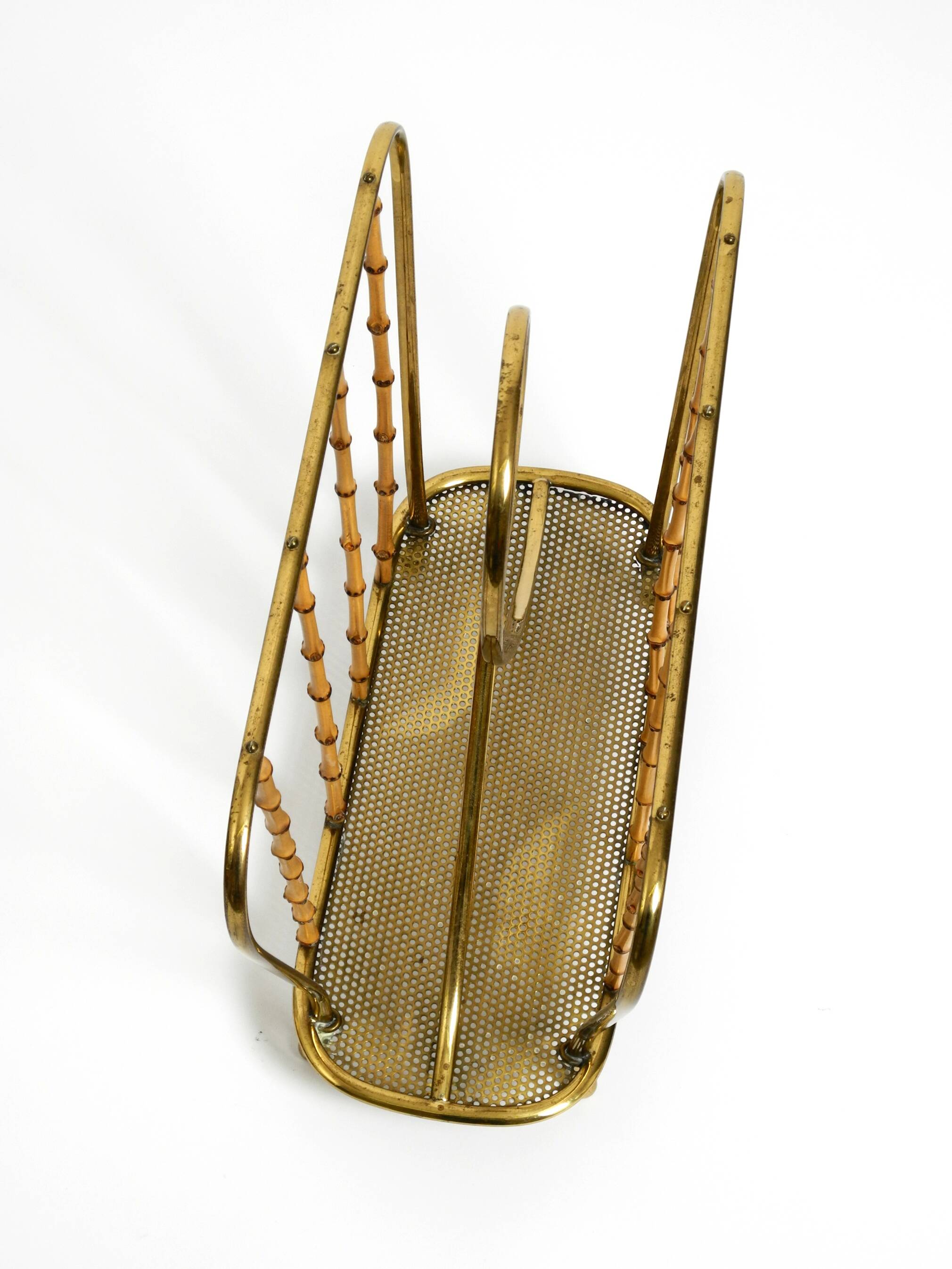 Rare Mid Century Modern magazine rack made of solid brass and genuine bambo