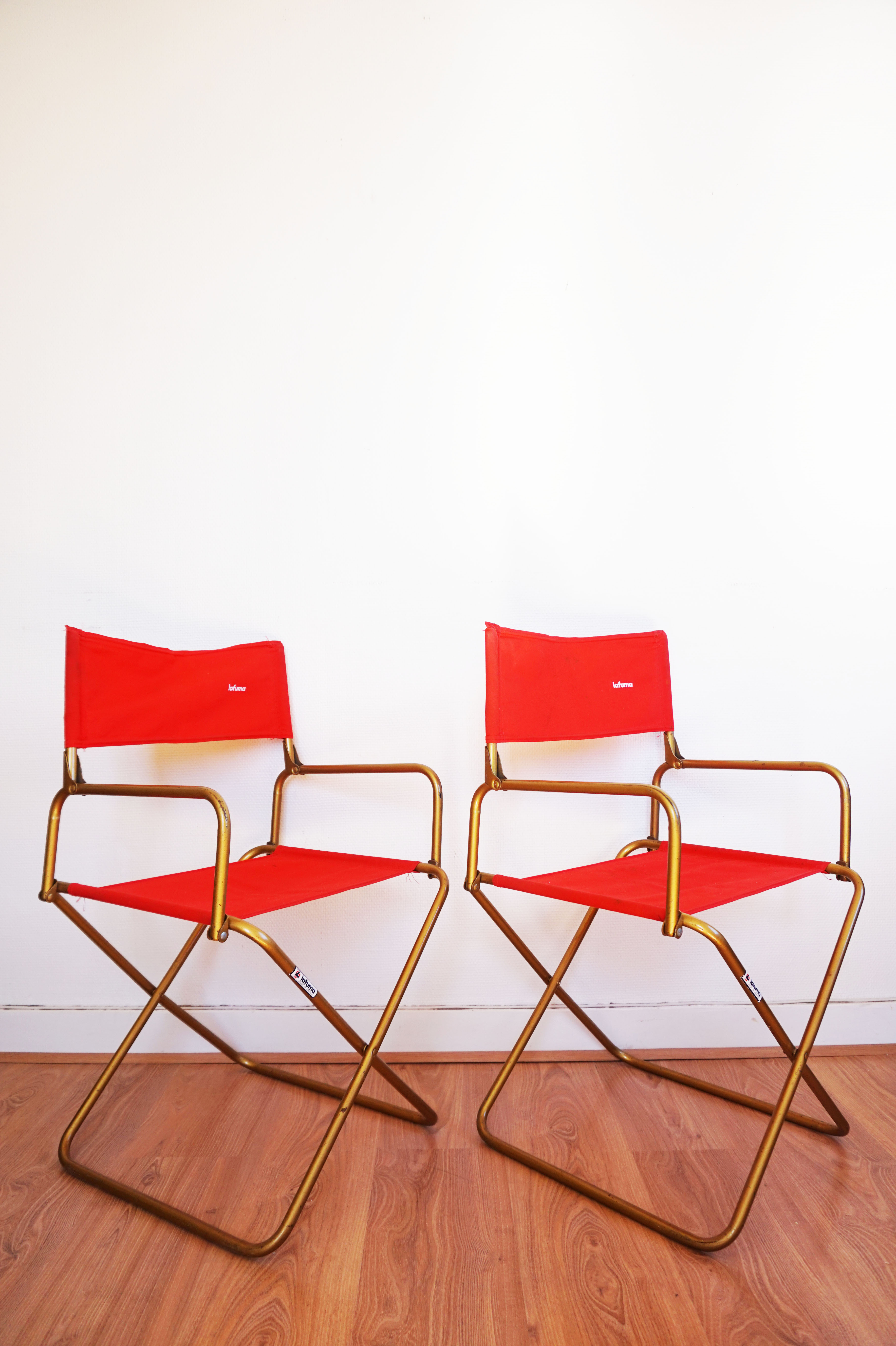 Red vintage pair of lafuma folding chairs
