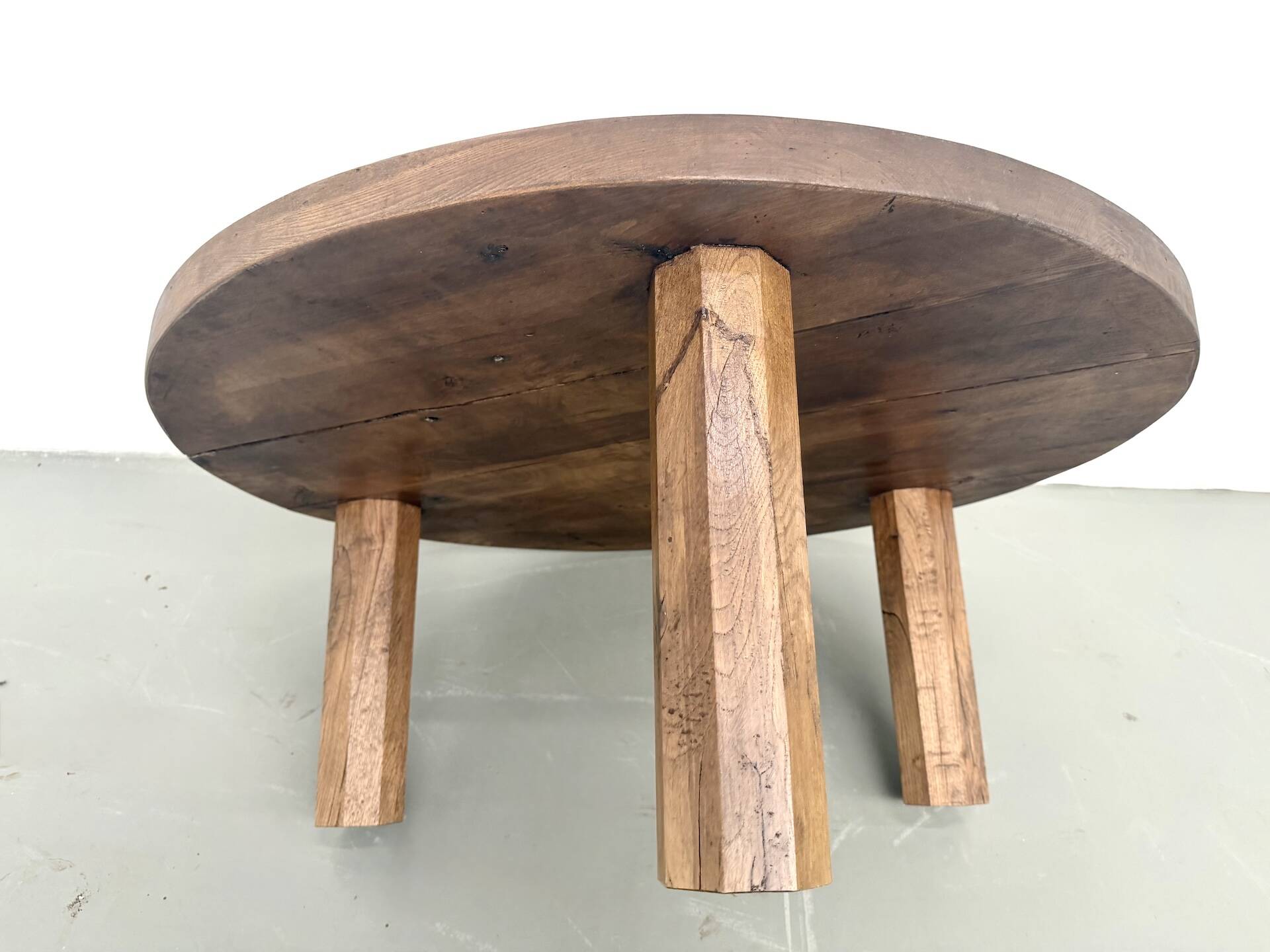 Round coffee table in solid oak, octagonal legs, France, 1950s.