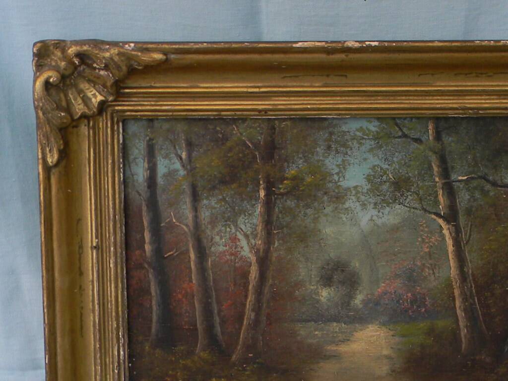 Old signed landscape painting under wood.