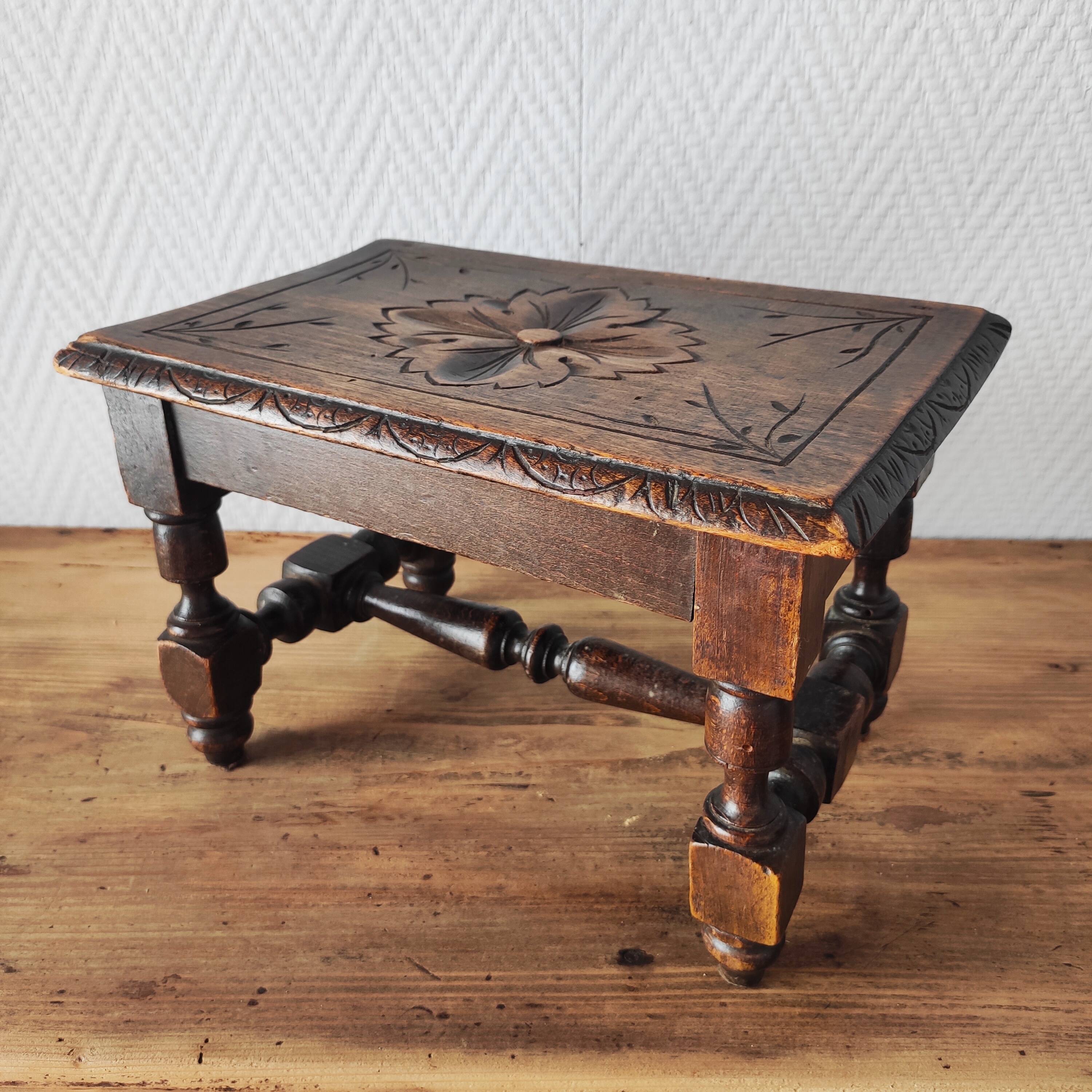 Old carved wooden footrest