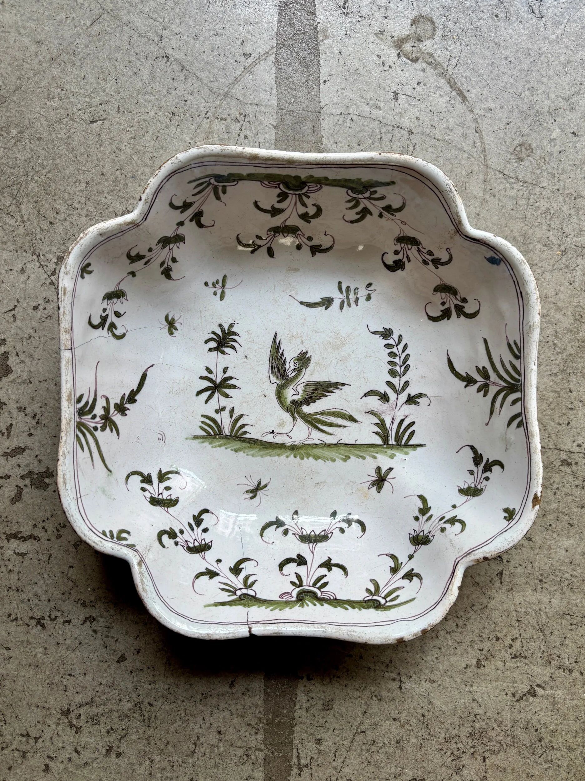 Moustiers salad bowl in cream and green earthenware, 18th century.