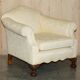 Pair of Edwardian armchairs from 1910 with carved legs and fabric.