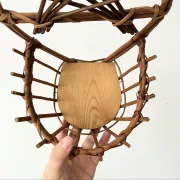 Wall-mounted plant holder in rattan