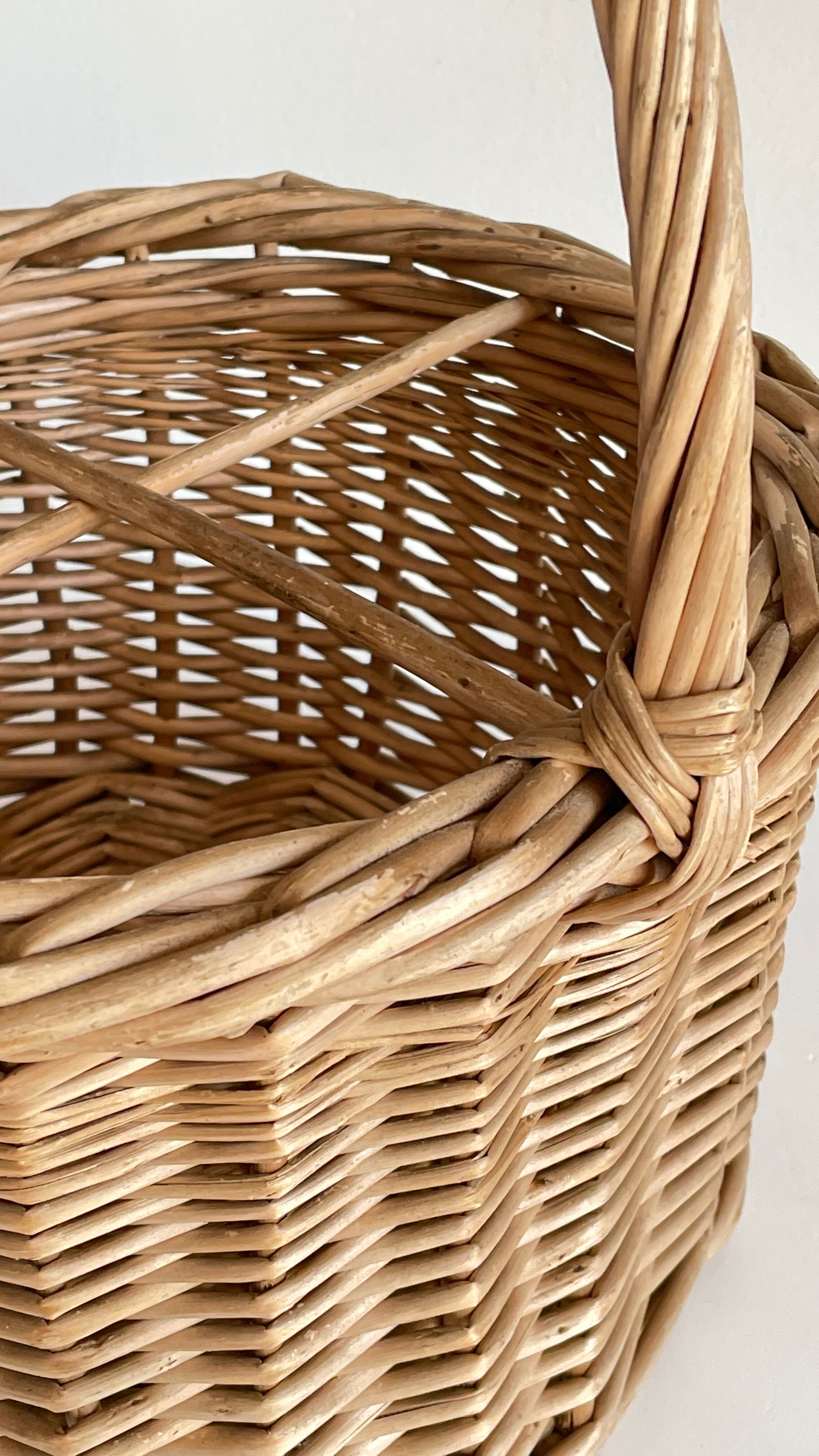 Basket with vintage rattan bottles