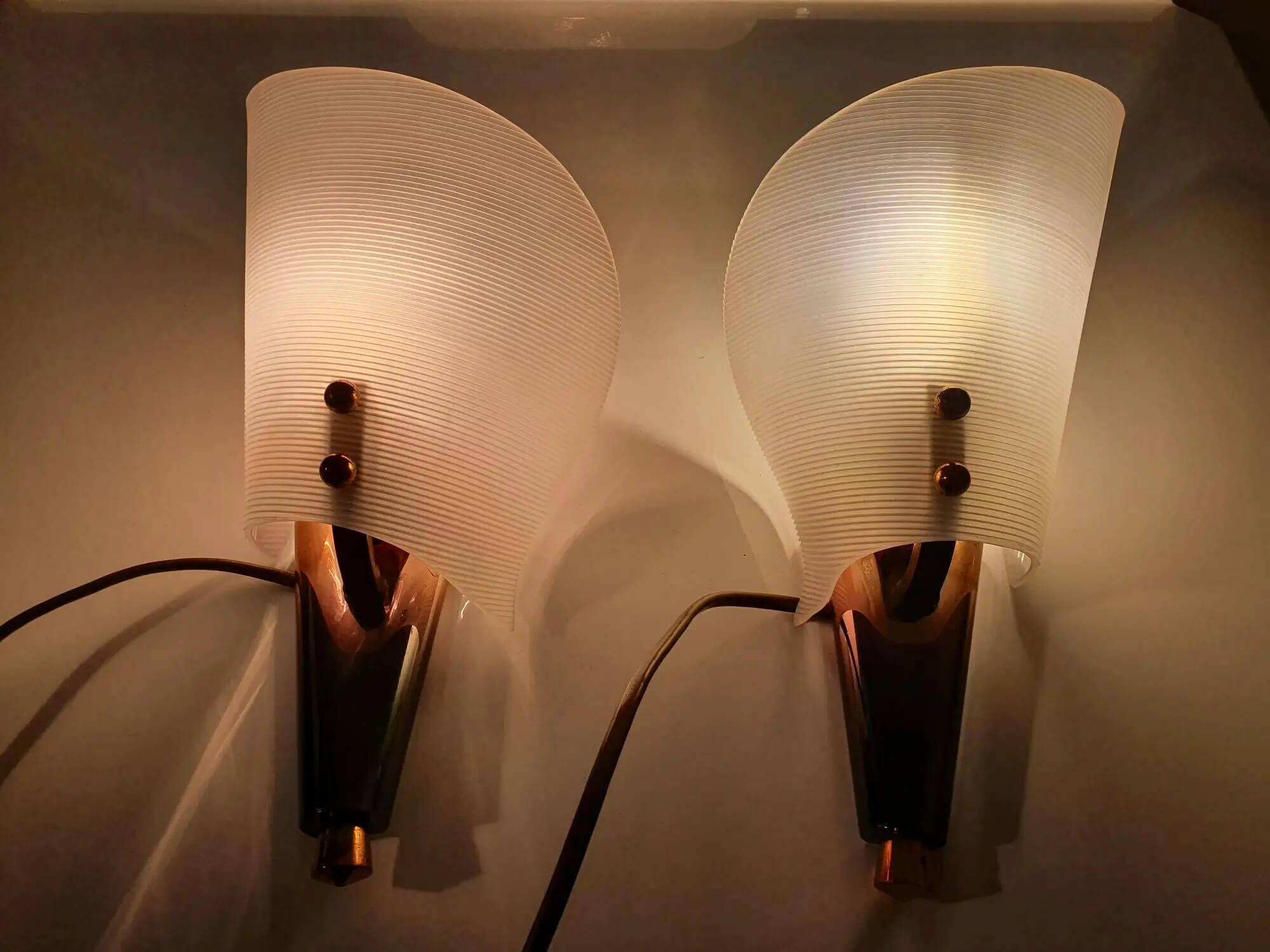 Pair of copper and plexiglass torch wall lights from the 1960s
