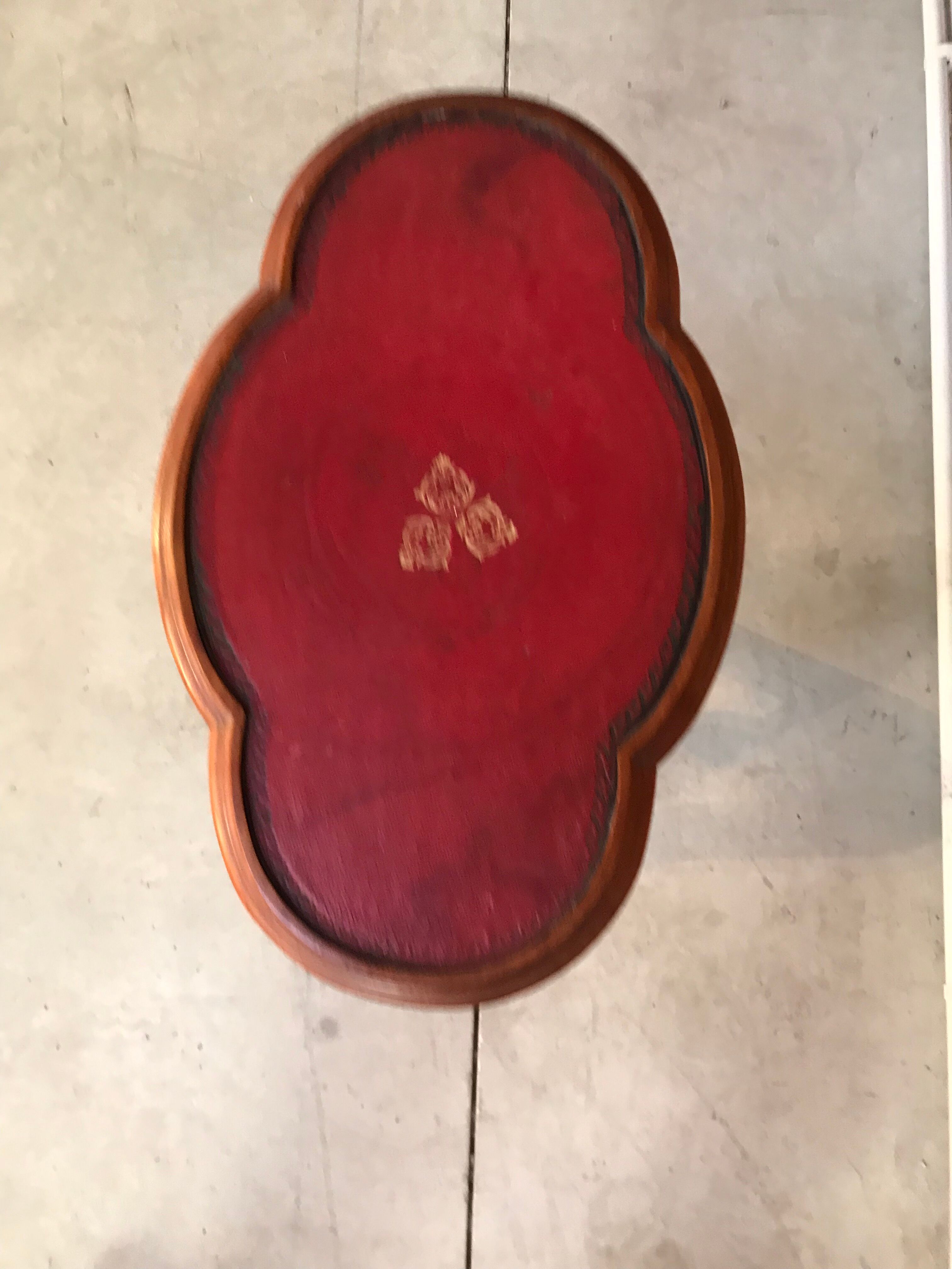 Wooden pedestal table red leather top