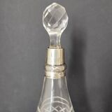 Crystal bottle with silver metal neck rim