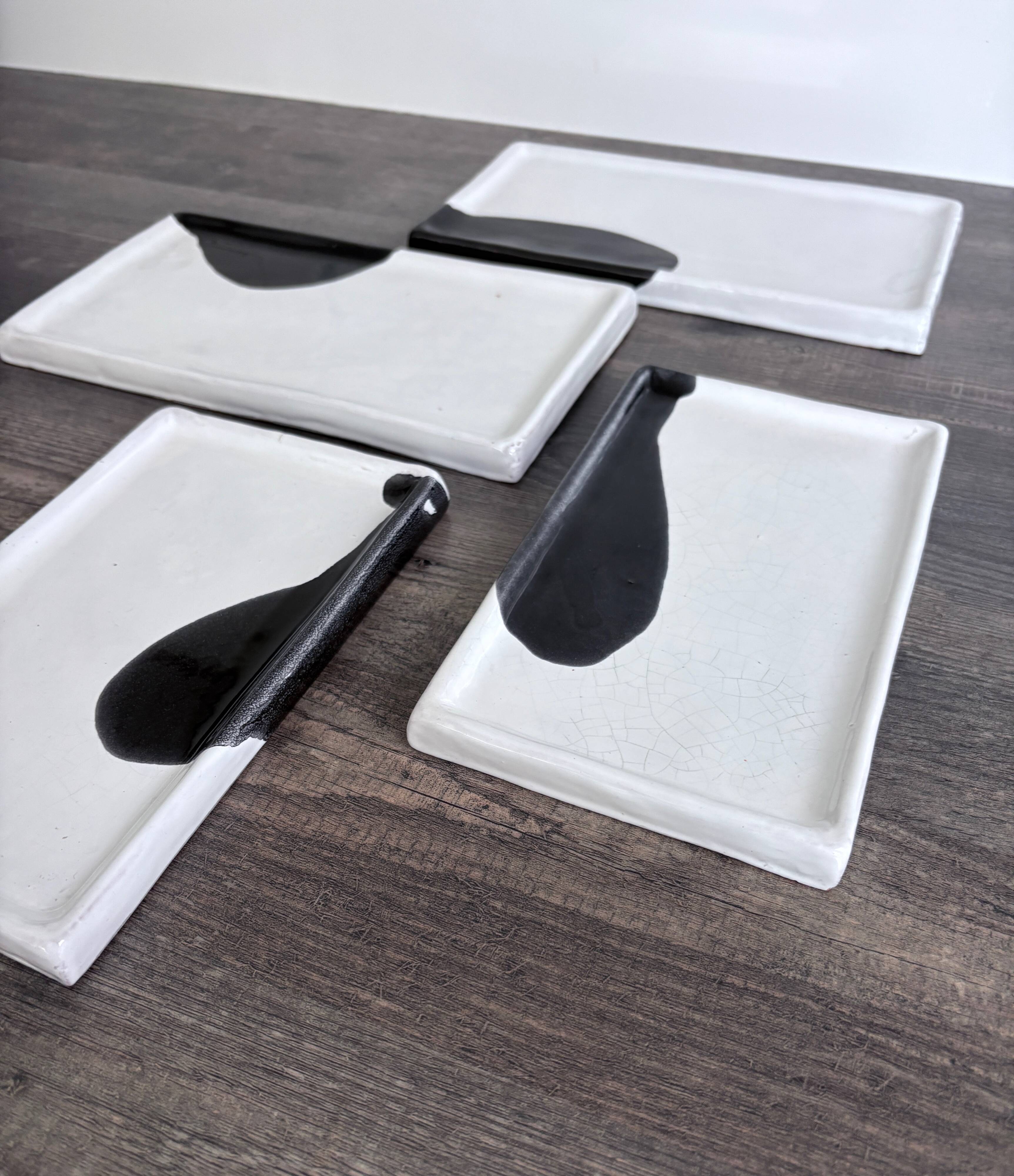 Lot of 4 rectangular glazed terracotta plates.