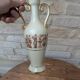 Antique amphora-shaped vase with Roman or Greek decoration