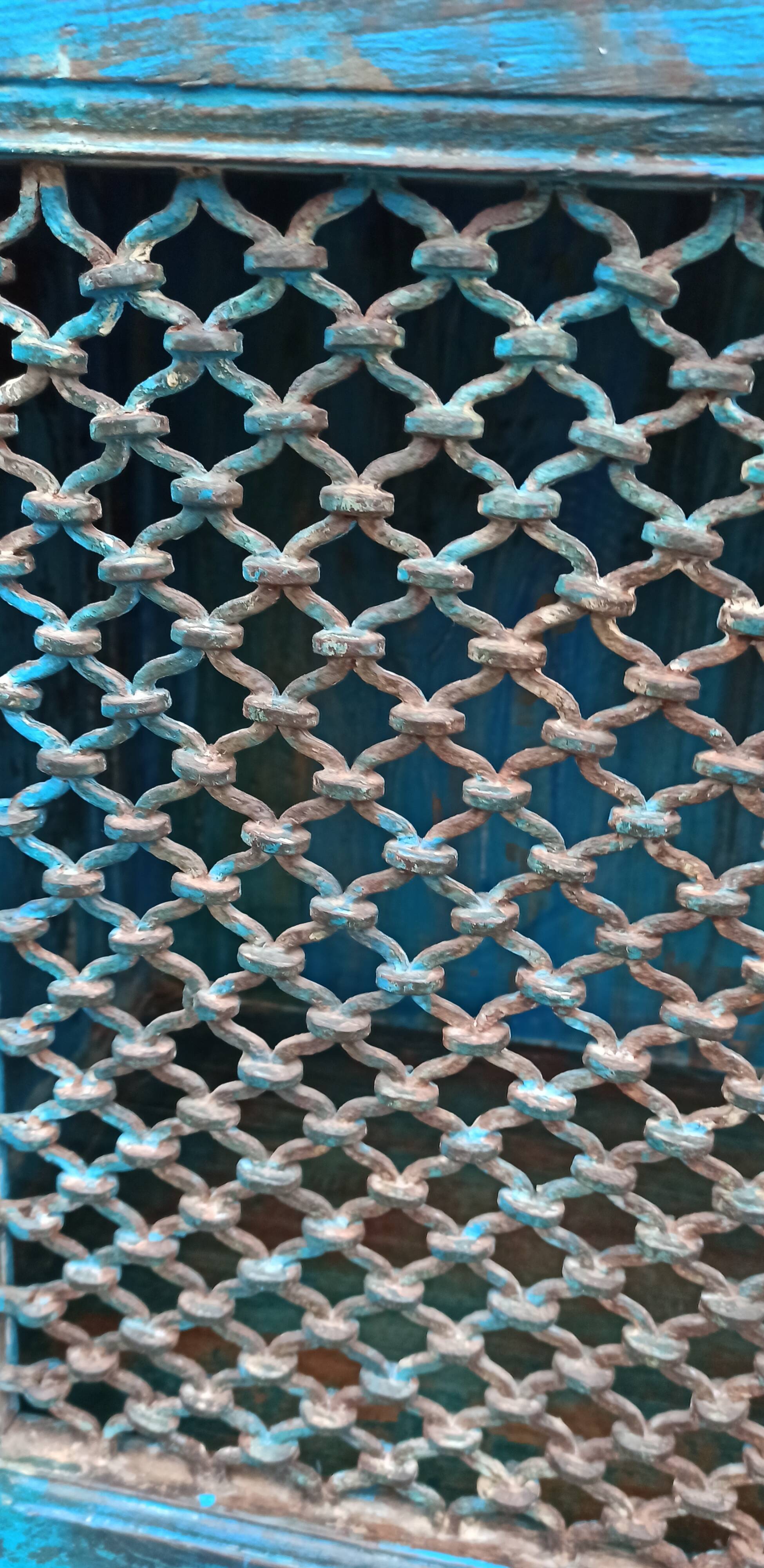 Old wooden cabinet with doors with grille