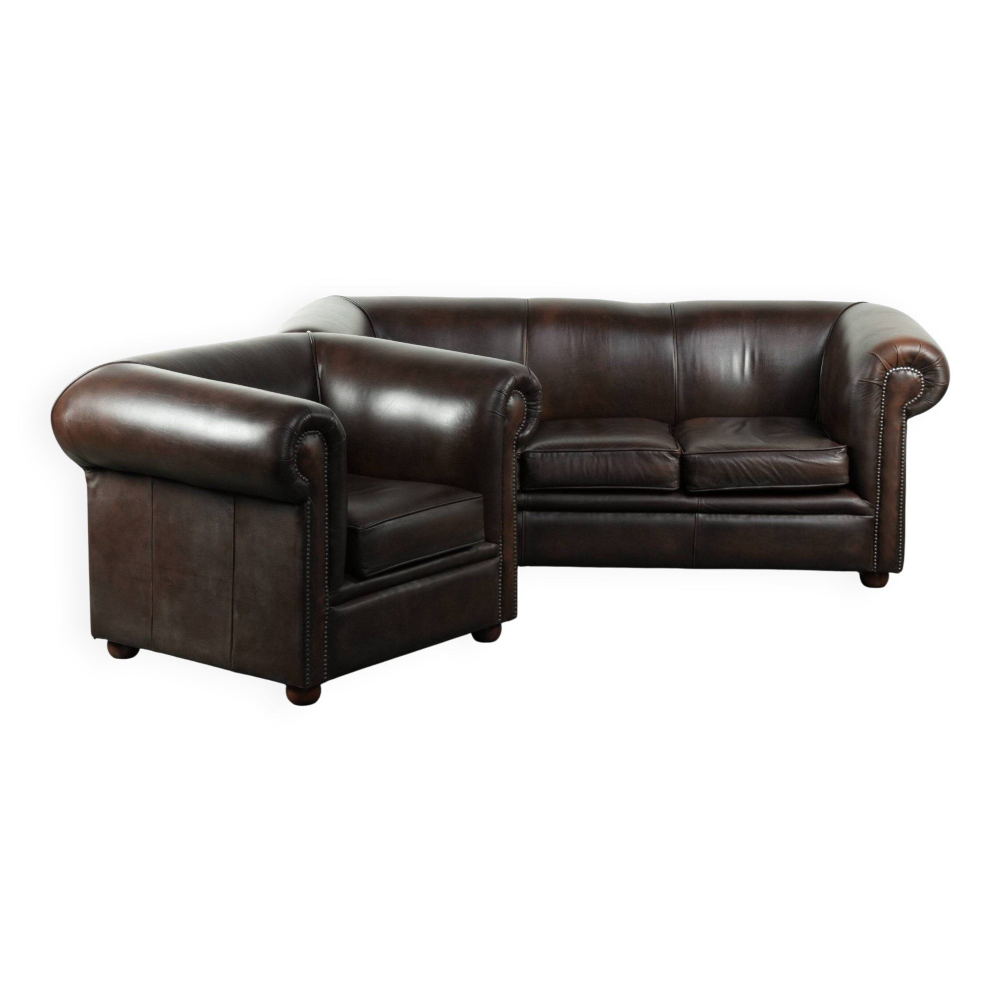 Set of a smooth chesterfield sofa and armchair with a timeless English look
