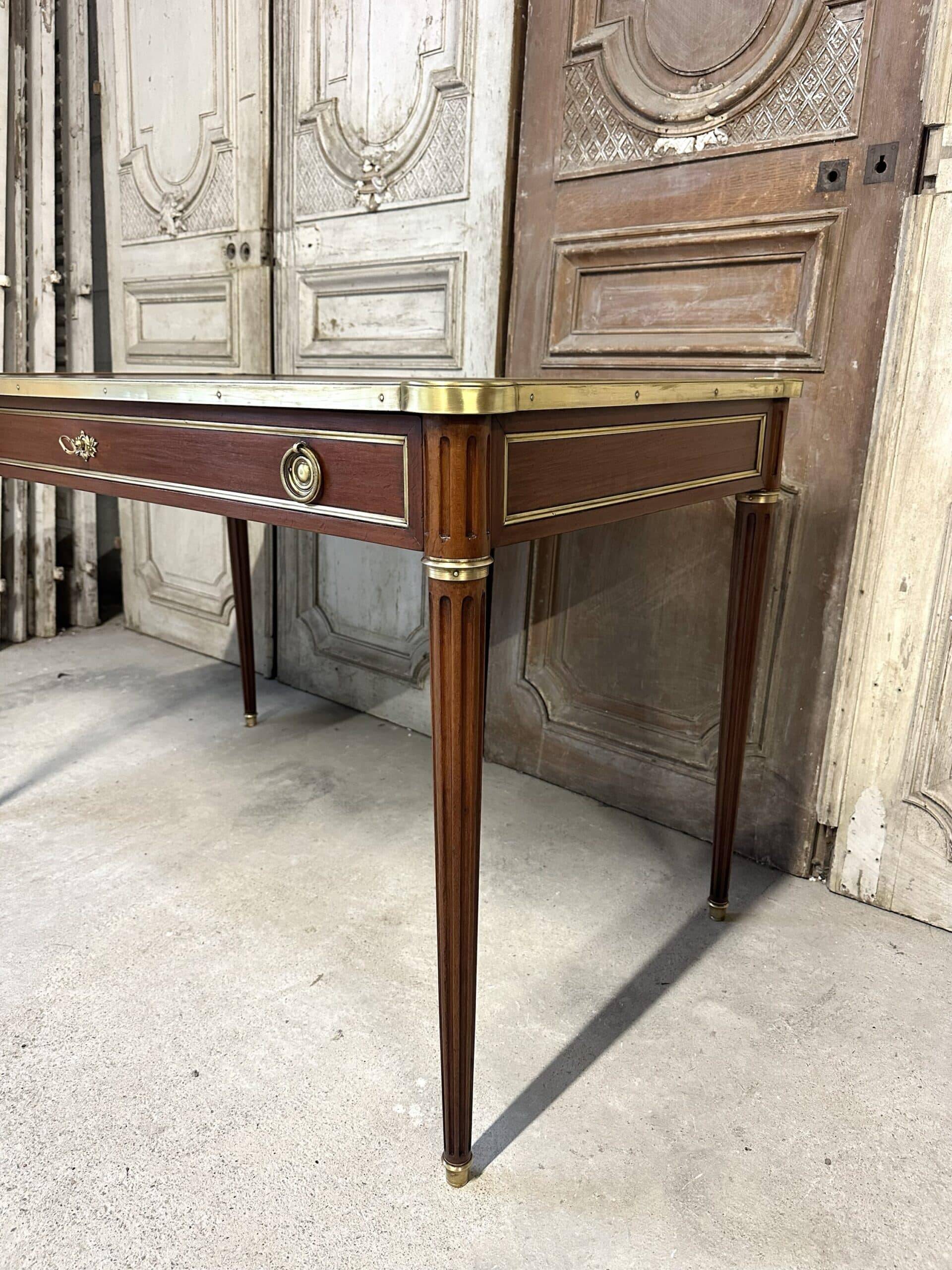 Louis XVI style flat desk in mahogany from around 1950.