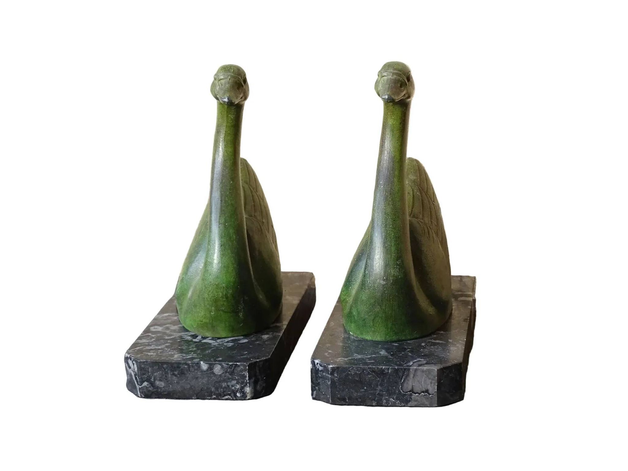 Vintage swan bookends on marble bases